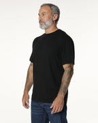 Man turned to the side, wearing a black Premium t-shirt. Model is 5'11", 198lbs wearing size L