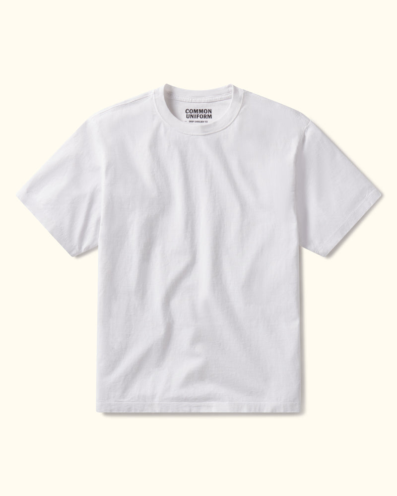 White t-shirt with 'Common Uniform' logo on a white background