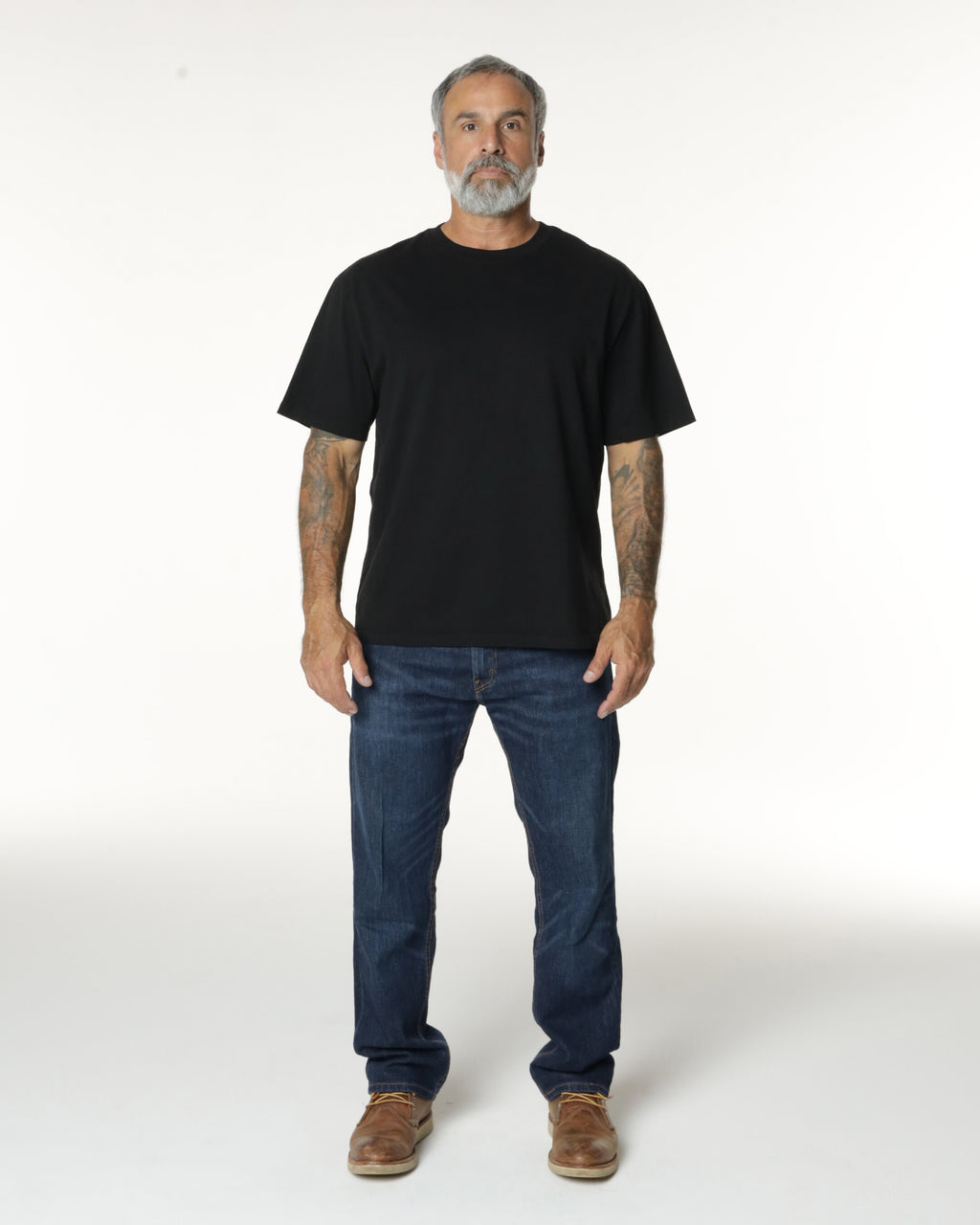 Man wearing a black Mock Neck t-shirt. Model is 5'11", 198lbs wearing size L
