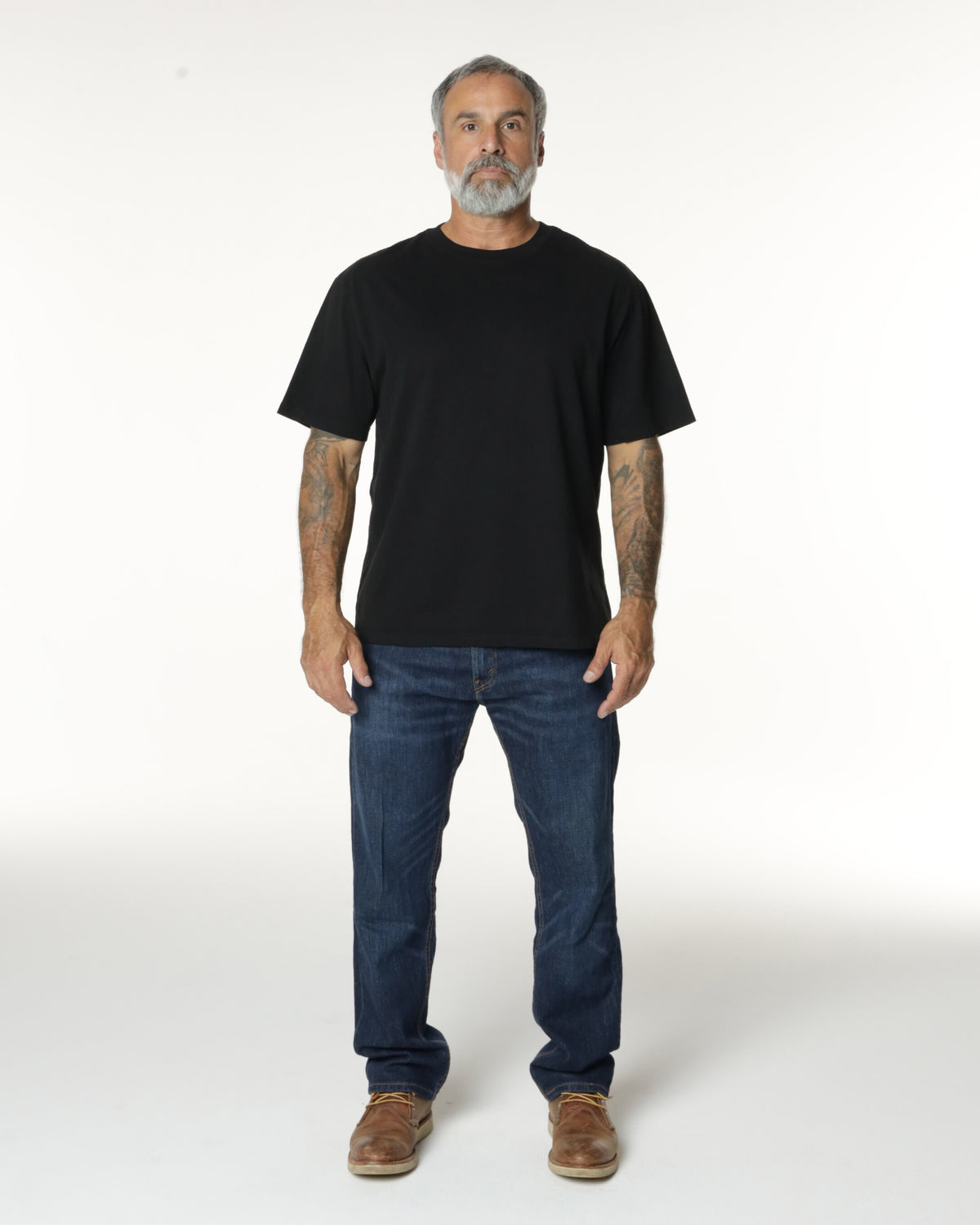 Man wearing a black Mock Neck t-shirt. Model is 5'11", 198lbs wearing size L