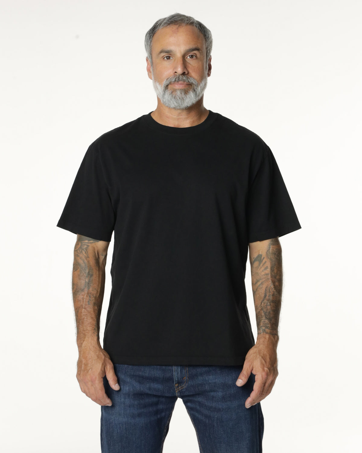 Man wearing a black Mock Neck t-shirt. Model is 5'11", 198lbs wearing size L