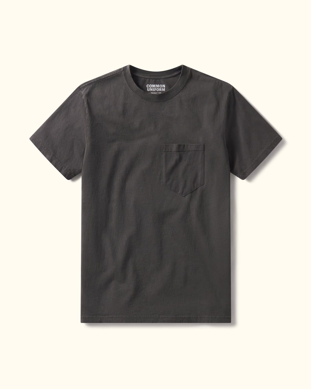 Steel Grey t-shirt with a pocket on a beige background