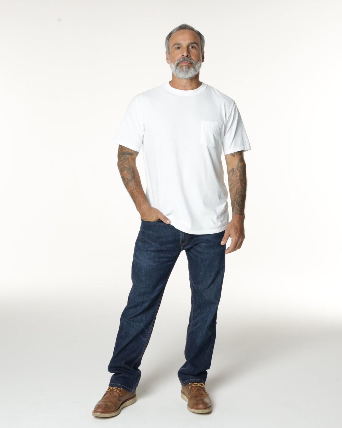 Man wearing a White Pocket t-shirt and jeans. Model is 5'11", 198lbs wearing size L